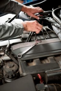 Mechanic Working On Car